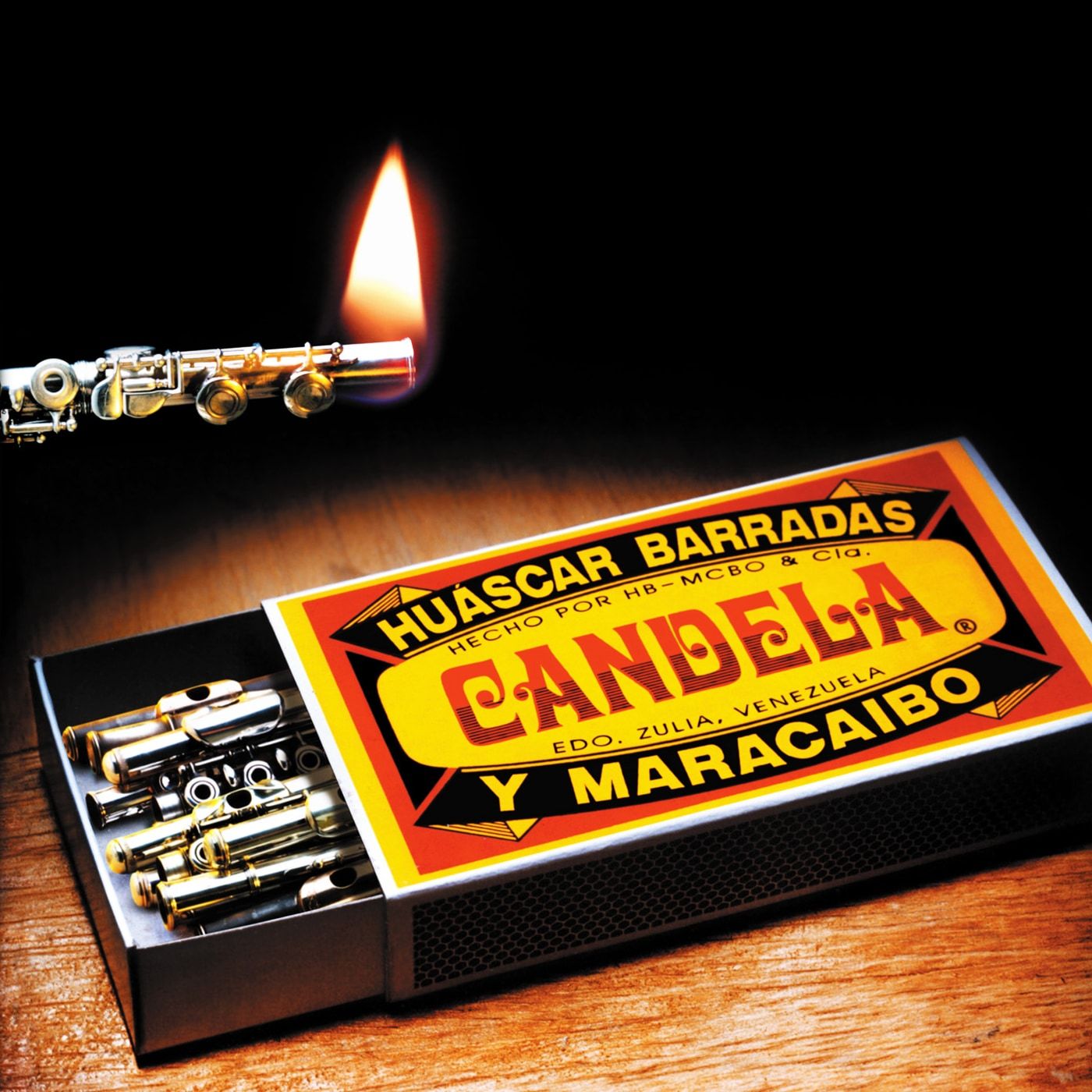 Cartel de muestra del concierto, con el arte del disco Candela: una caja de fósforos donde los fósforos son flautas.